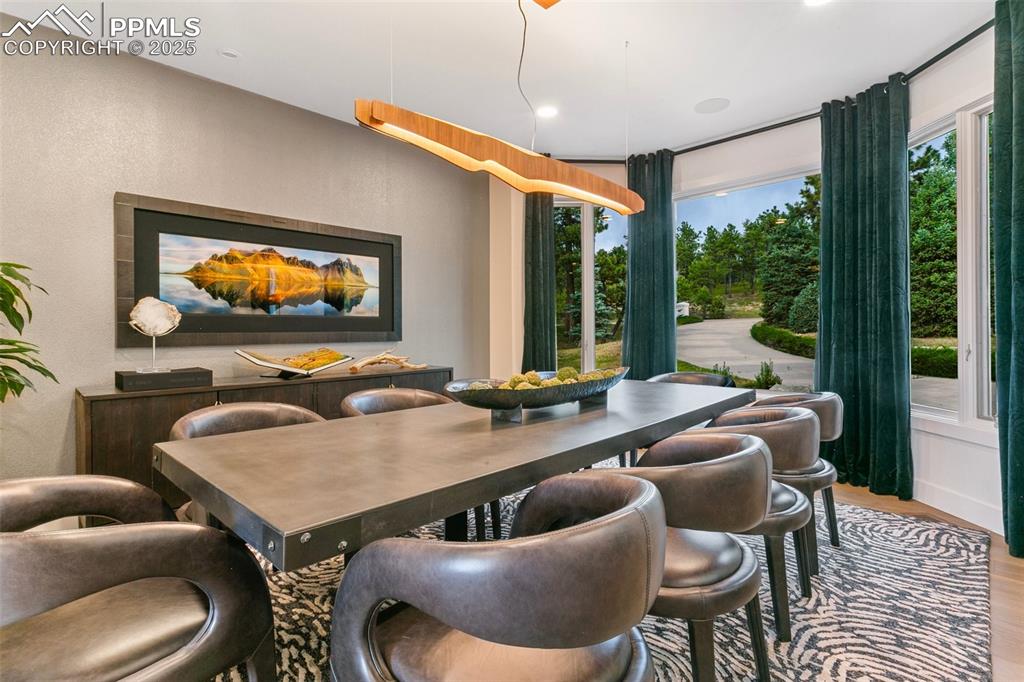 Dining Space can easily accommodate 12 seats. 10 Oversized Chairs are pictured here.