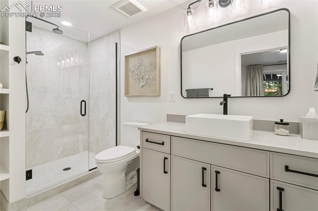 Custom shower with 2 heads and large vanity 