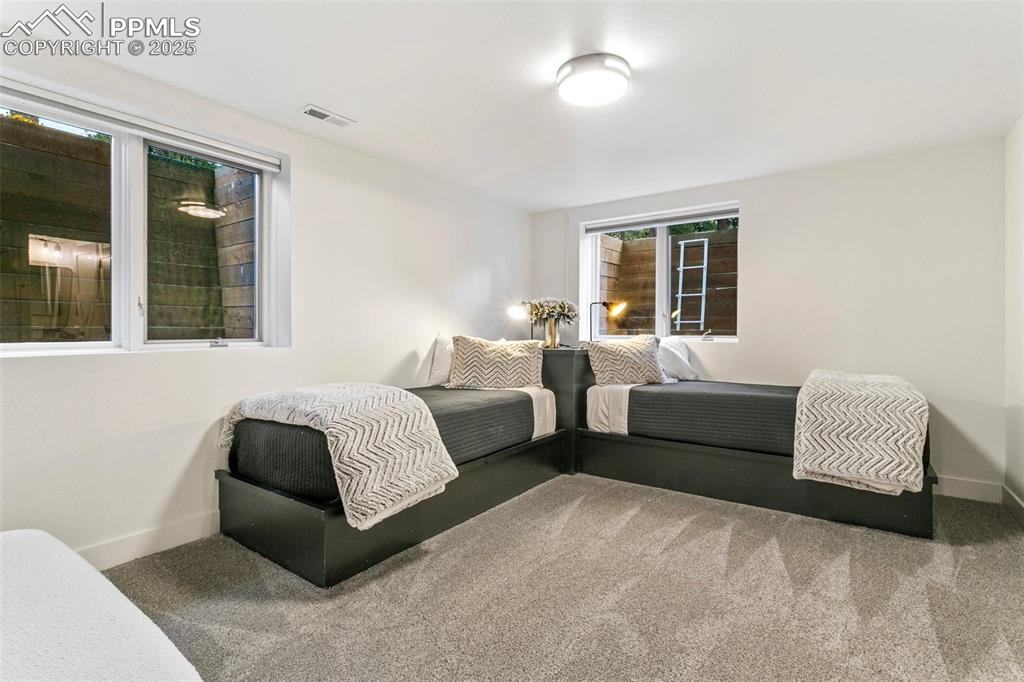 Space enough for 2 in this ensuite bedroom that also has a large Walk in Closet. 