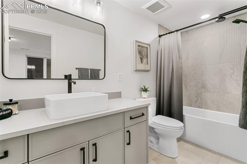 Private ensuite bath with Tub/shower and oversized vanity adjoins the bedroom. 