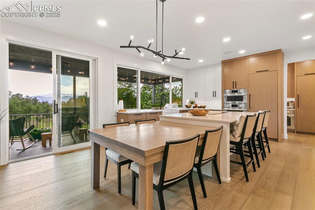 Built-in White Oak Table expands the eat-in kitchen seating