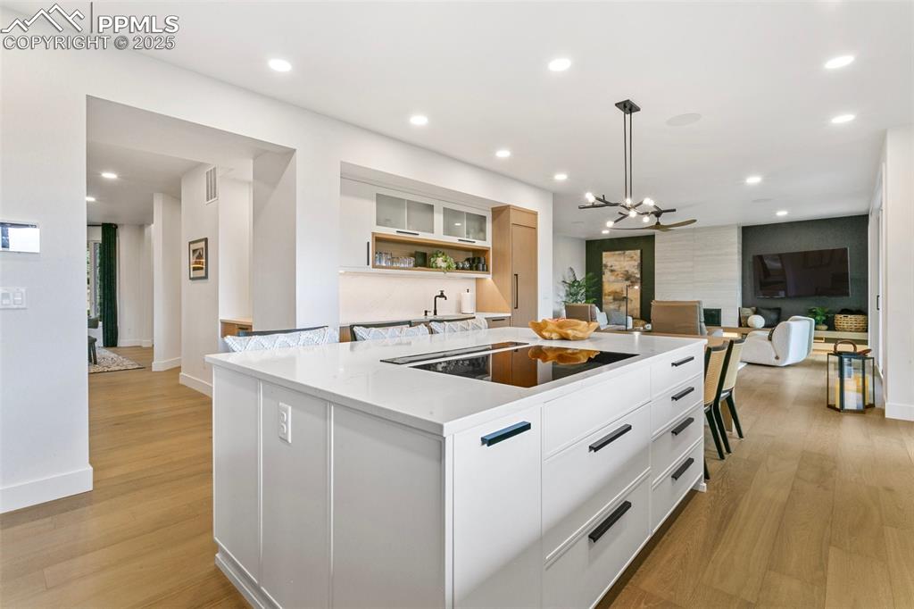 Island has flush inset Induction Cooktop and is also pre plumbed for gas. Plus 2 dishwashers, 2 refrigerators, 2 ovens, microwave and Full size Freezer!