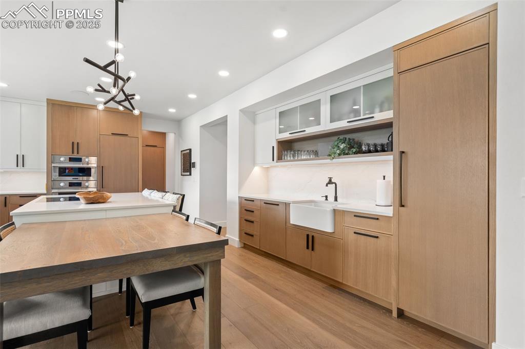 Dedicated Beverage station with apron front sink, Built in column refrigerator and all things "drink relted" are locate here, freeing up chef zone. 