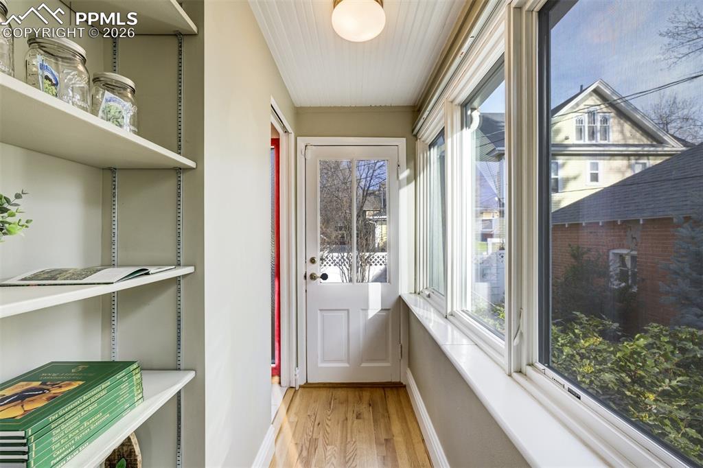 A charming passage to the backyard and main floor bathroom