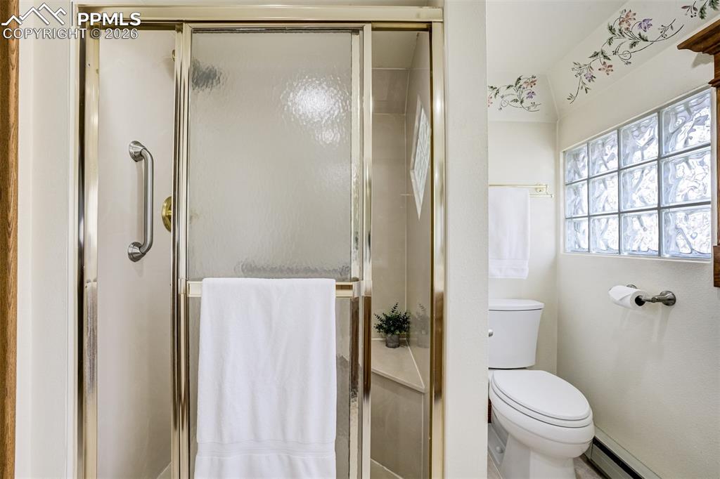 Featuring a shower with a seat