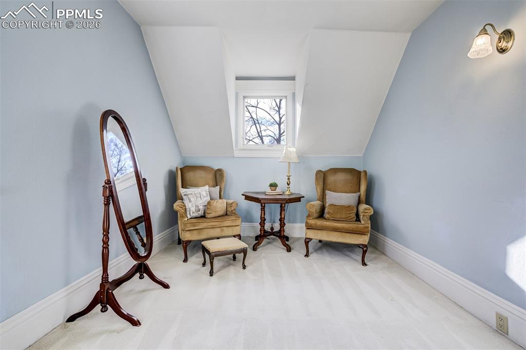 Sitting area in second bedroom is charming