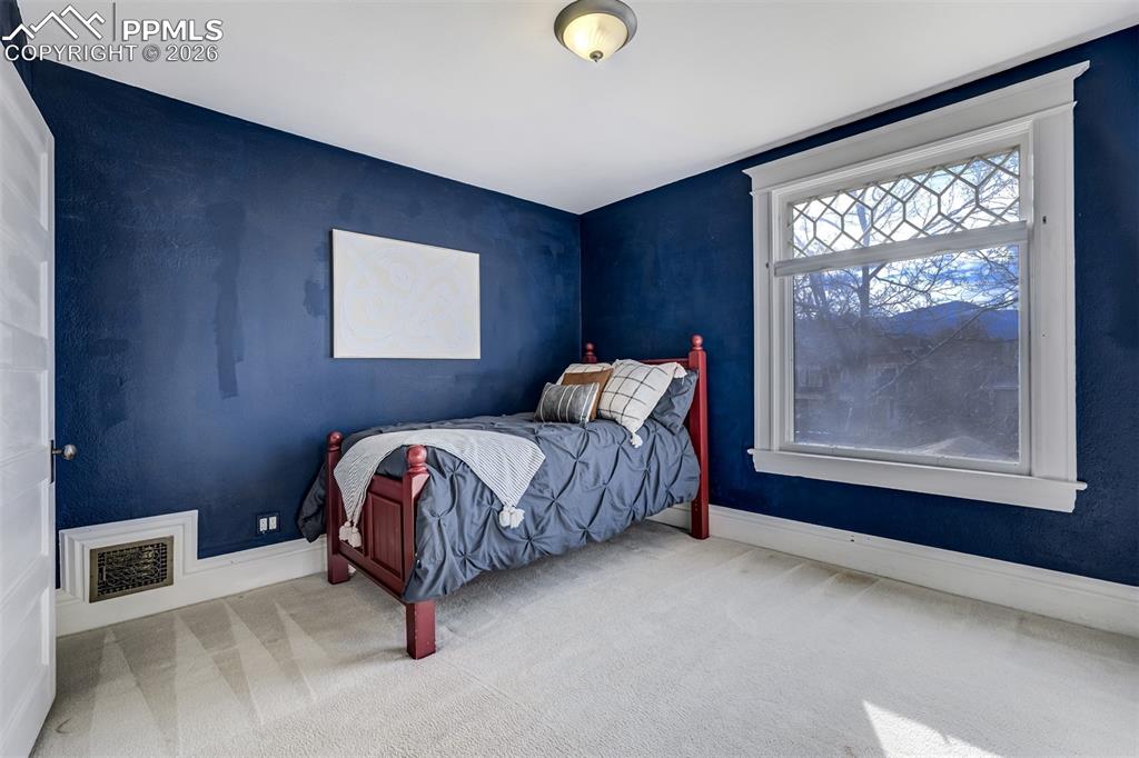 Third bedroom upstairs with window to front of home