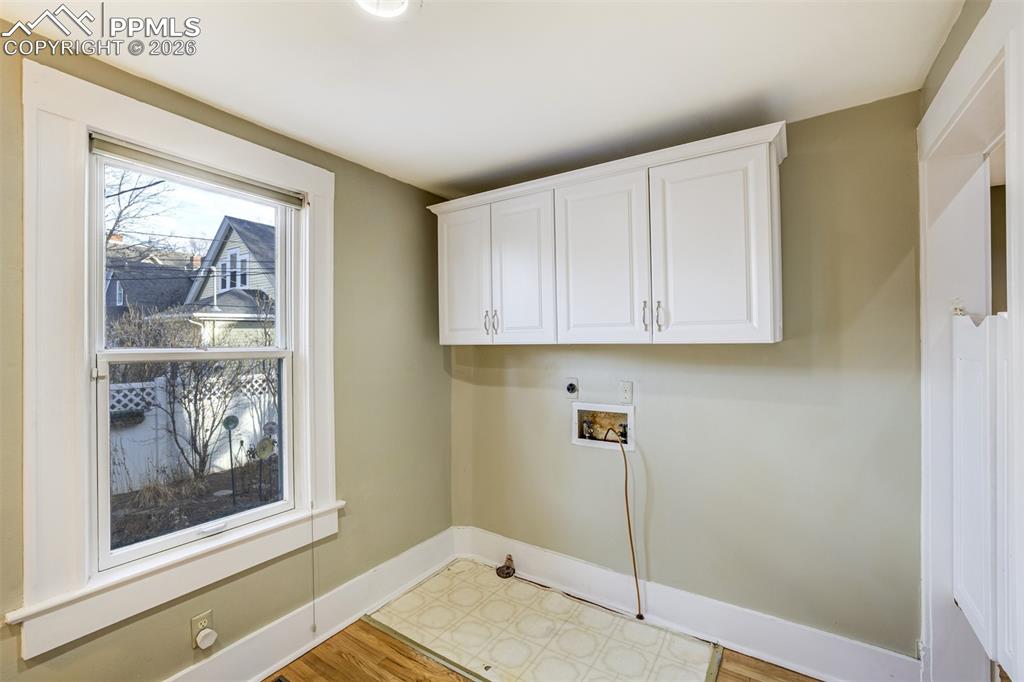 Laundry room with cabinets and window!