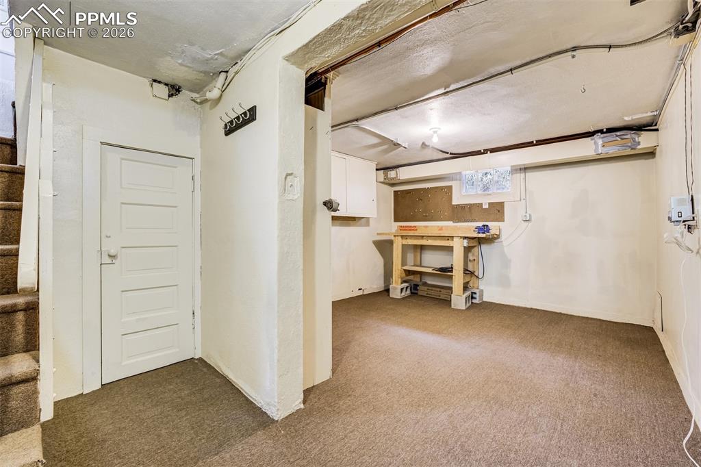 Basement offers abundant storage and great space for workshop and hobbies!