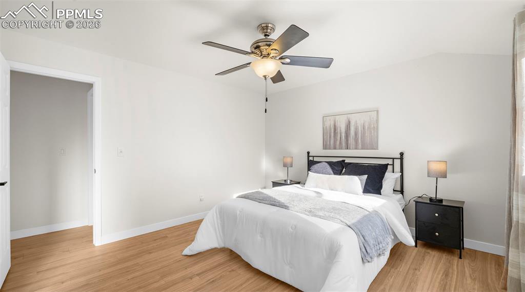 Bedroom featuring ceiling fan and light wood-type flooring