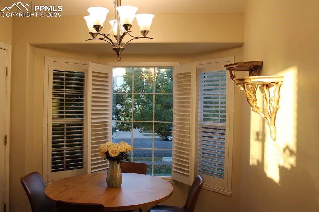 Dining area with a chandelier