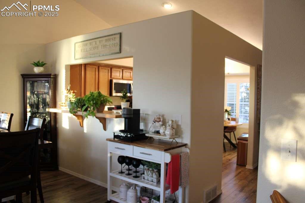 Hall featuring dark wood-style floors