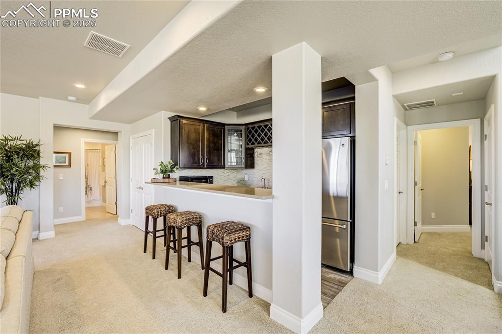 Well appointed wet-bar designed for entertaining