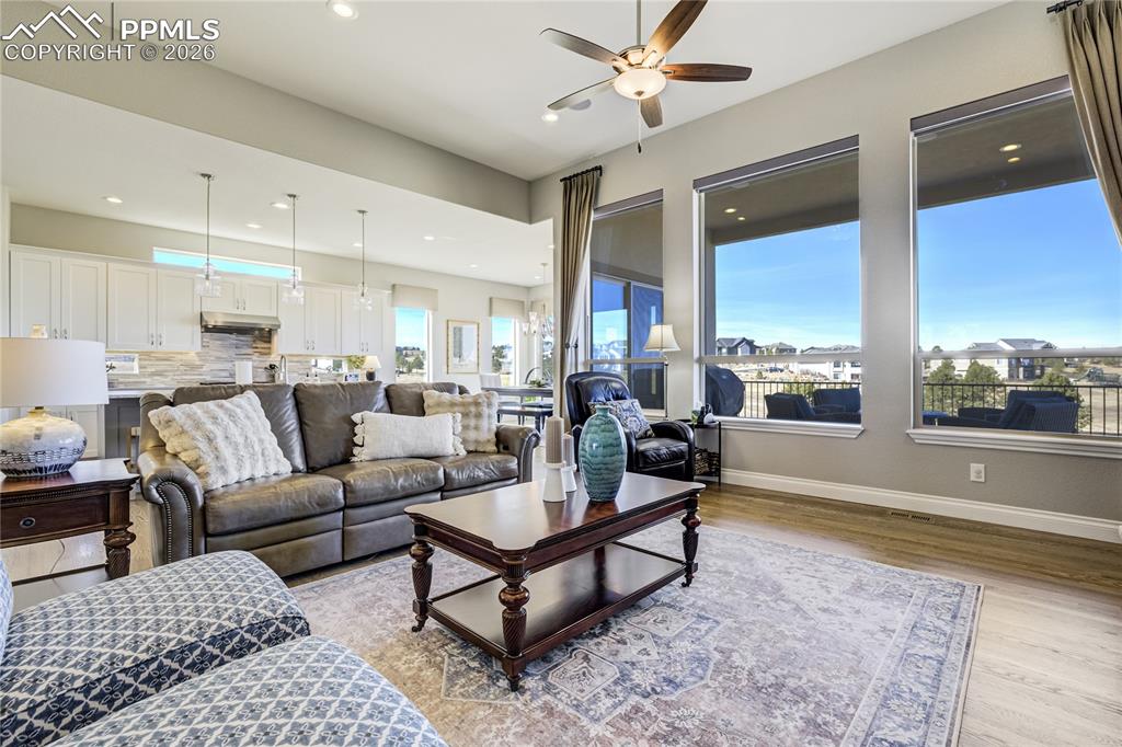 Expansive windows draw in open land and horizon, reinforcing architectural scale and connection to the landscape.
