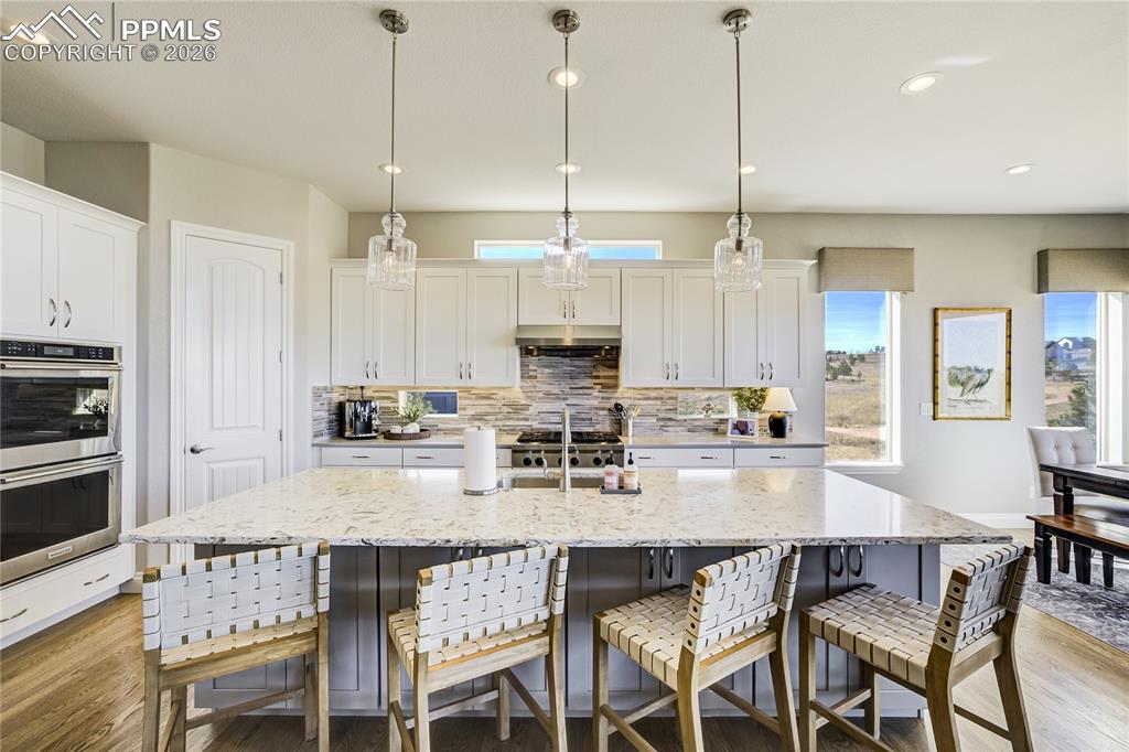 Generous island designed for gathering—blending function, proportion and elevated finishes.