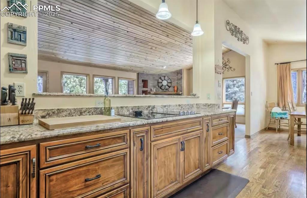 Bathroom with vanity, light wood finished floors, and wooden ceiling