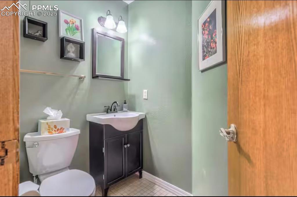 Half bath with vanity and toilet