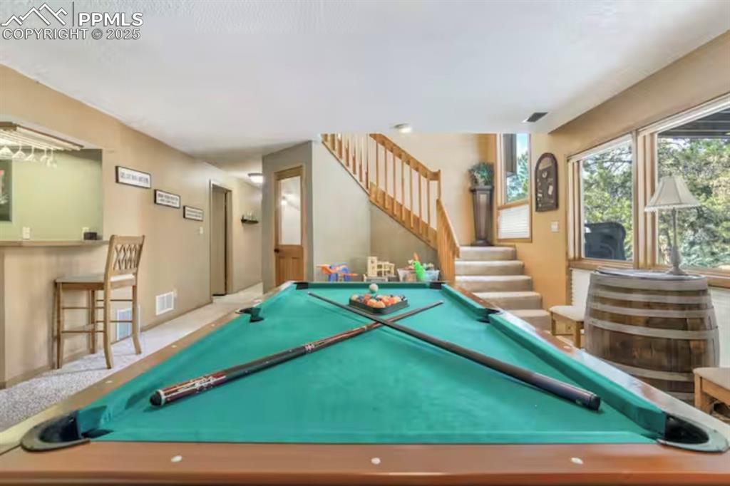 Game room with billiards table and carpet