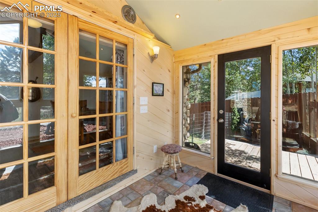 Sunroom entry with french doors into main level.