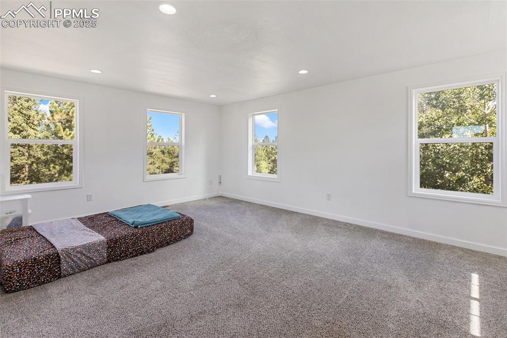 Upper level nonconforming bedroom with multiple windows. Could serve as living room, family room, other.