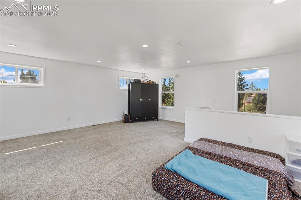 Nonconforming bedroom on upper level with closet cabinet.