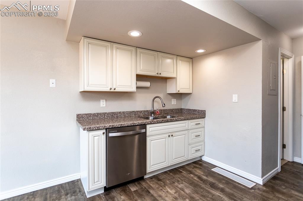 main level half bathroom is just off the kitchen