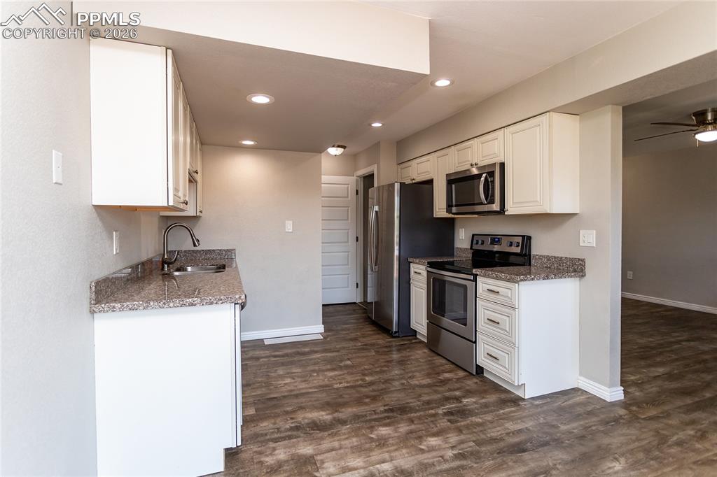 Door to basement level is just off the kitchen