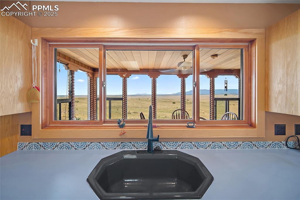 Kitchen view of mountains and light countertops