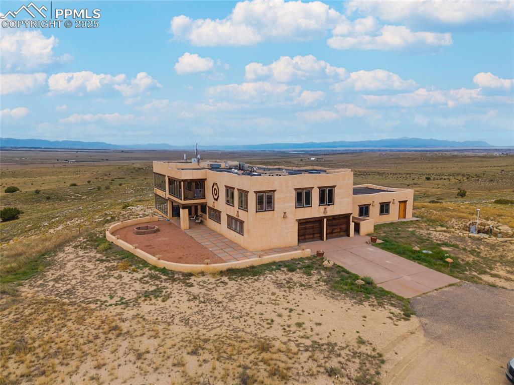 View of subject property featuring a mountainous background