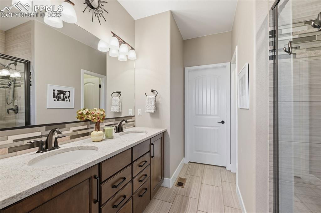 Granite counters and custom tiling in the master bath!