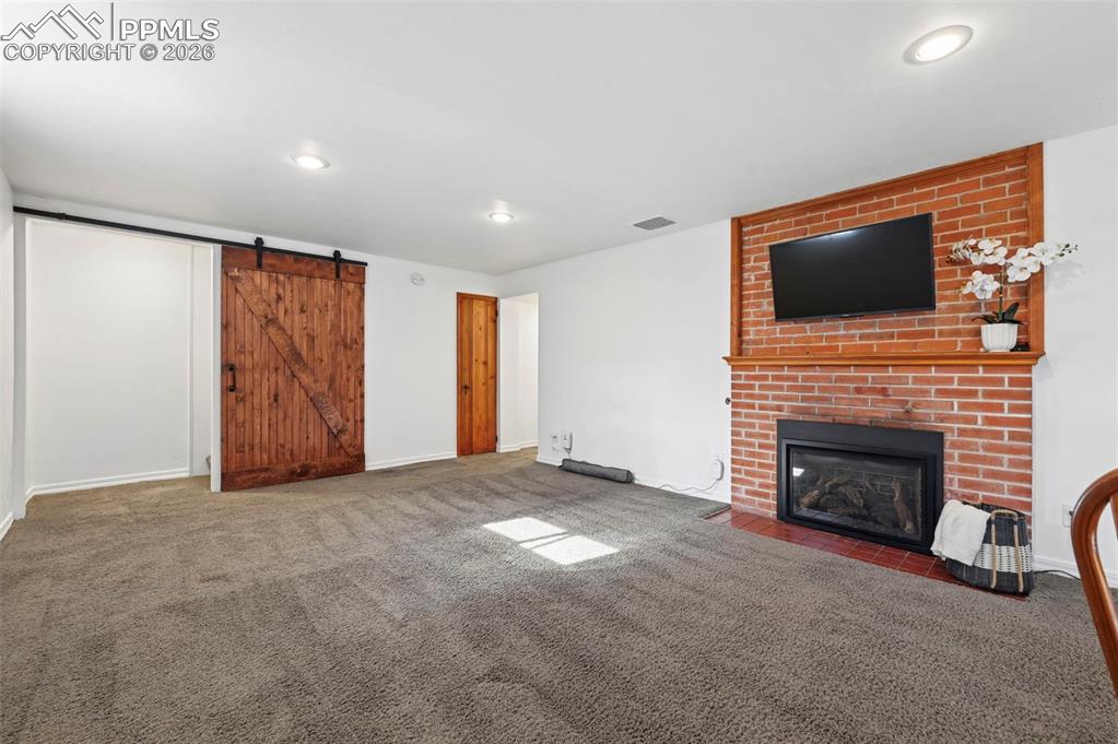 Basement family room with gas fireplace