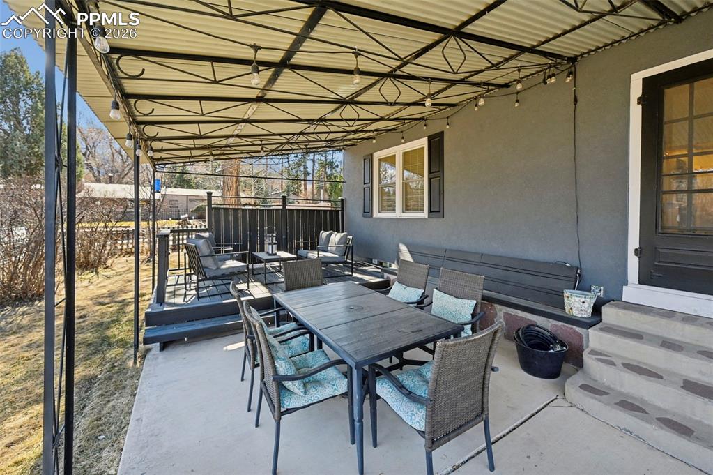 Outdoor covered patio dining off of formal dining room french doors