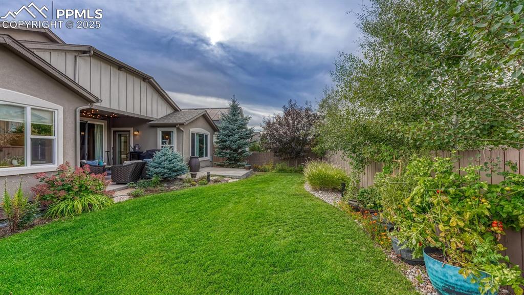 Fenced backyard featuring a patio area