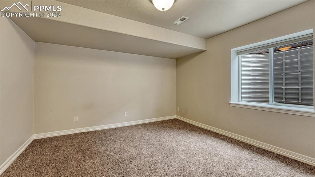 Bonus room featuring carpet flooring and baseboards