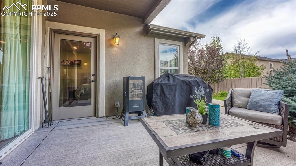 View of patio featuring area for grilling