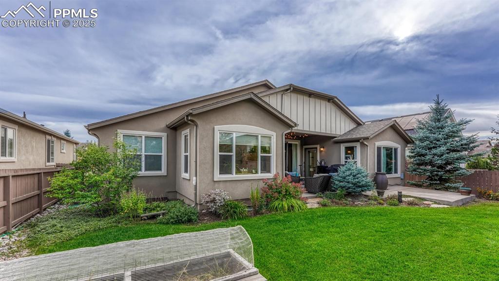 View of front of home featuring a patio area and stucco siding