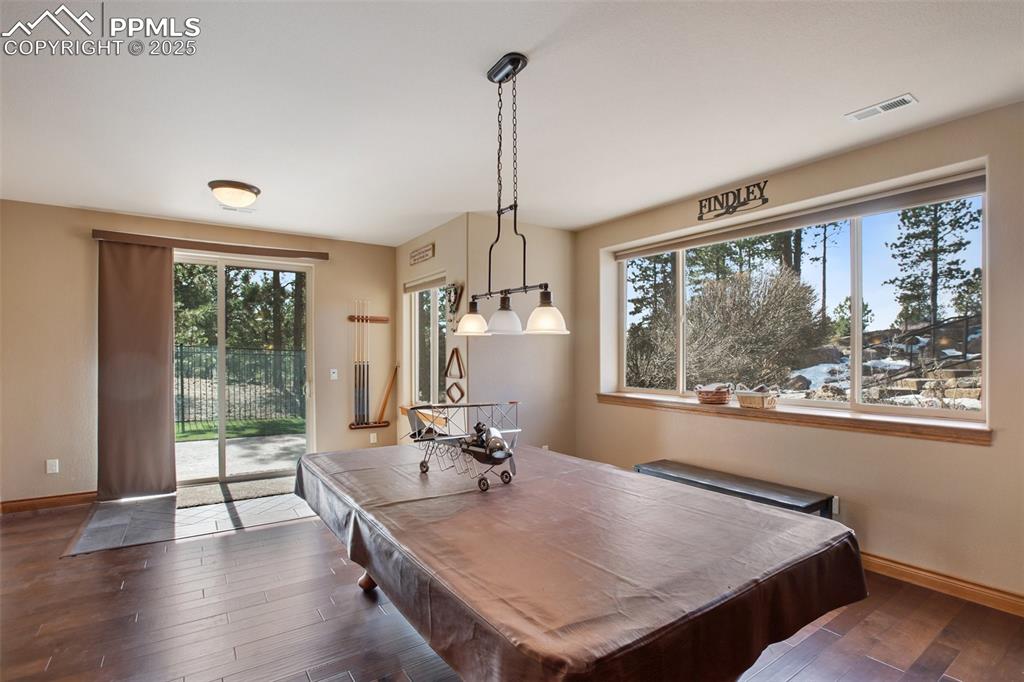 Recreation room with visible vents, billiards, baseboards, and dark wood-style flooring