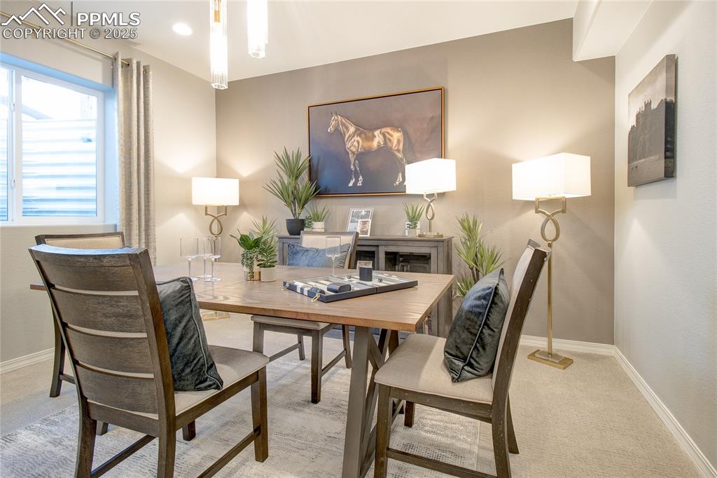 Carpeted office with baseboards