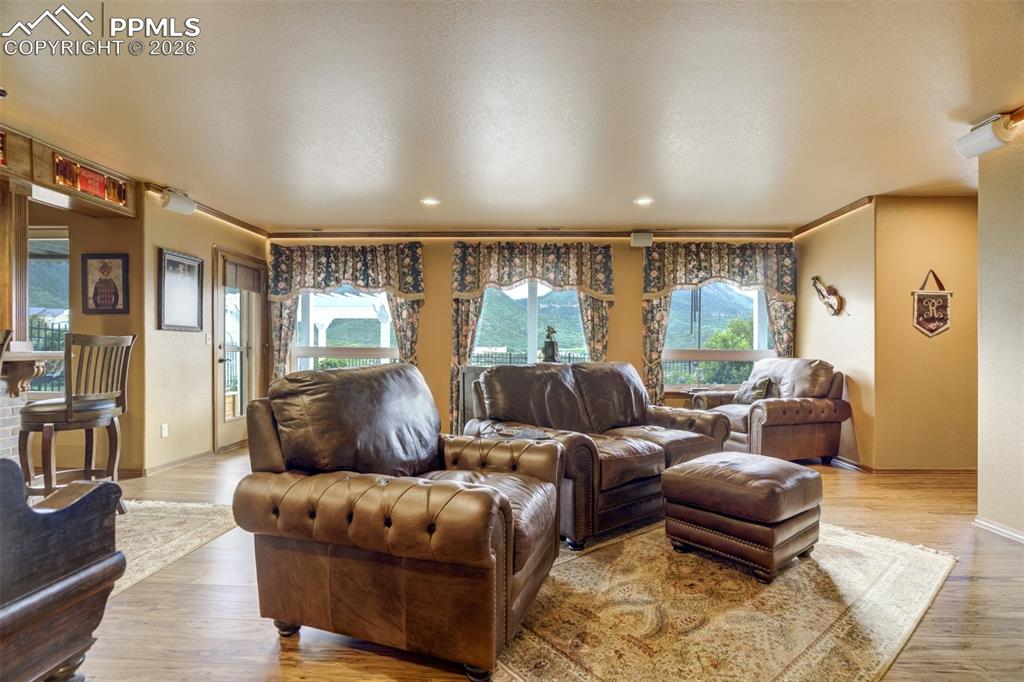 Lower level family room offers a custom wetbar and walkout to the fully landscaped backyard
