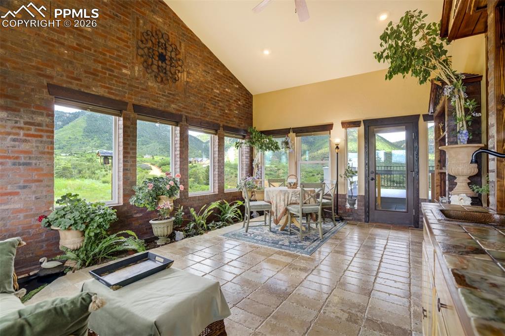 Lovely sun room with views on 3 sides, wet bar, and walkout to the back deck overlooking the valley and mountains