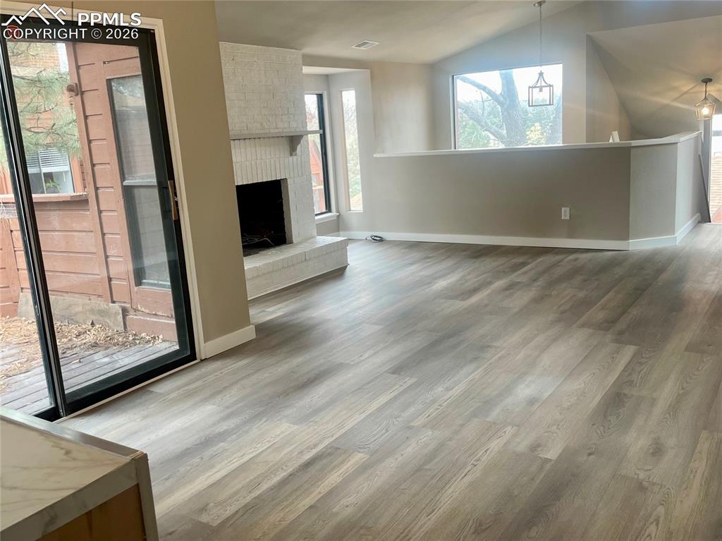 Dining area and Great Room.  Wood burning fireplace. 