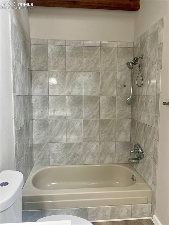 Remodeled Bathroom features dual flush toilet & tub/shower combo