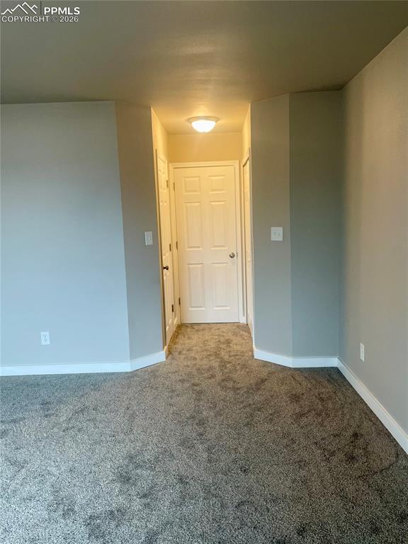 Looking toward Bedroom door. Walkin-in closet on the left; regular closet to the right.