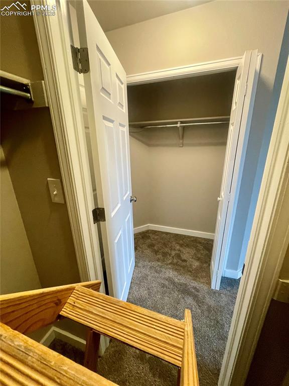 Looking from walk-in closet toward regular closet.