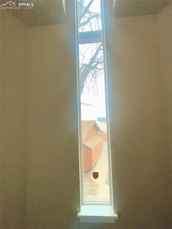 Detailed view of tall window on landing.