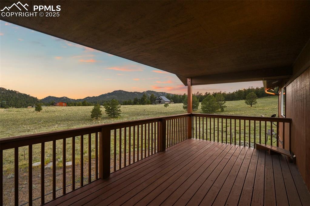 Covered deck with scenic mountain views. Exterior has since been freshly stained.