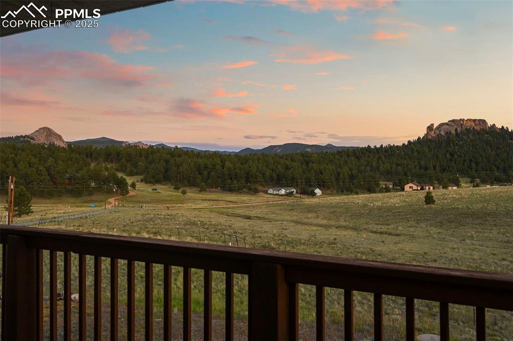 Covered deck with scenic mountain views. Exterior has since been freshly stained.