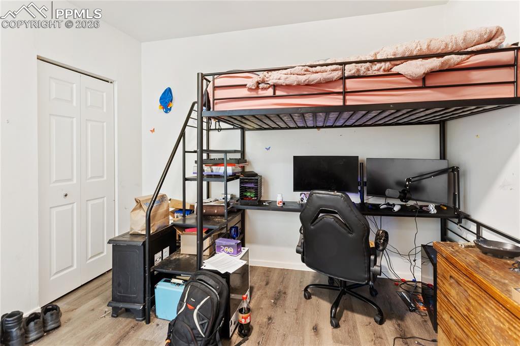 The second bedroom has wood-style finished floors and a closet!