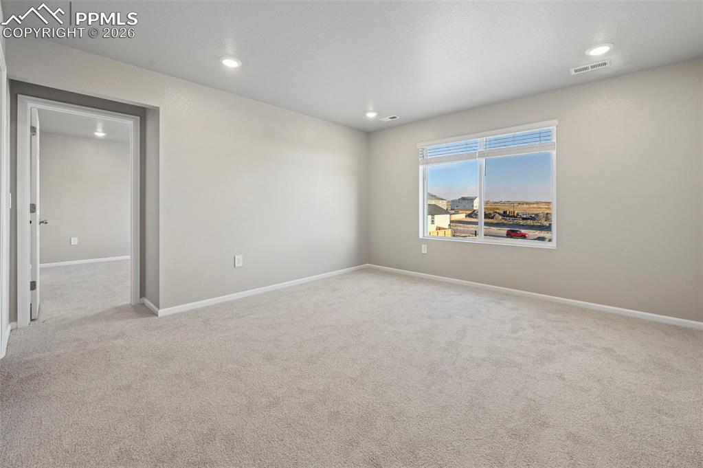 Unstaged oversized loft at top of the stairs, serves as family room, game room, sitting area!