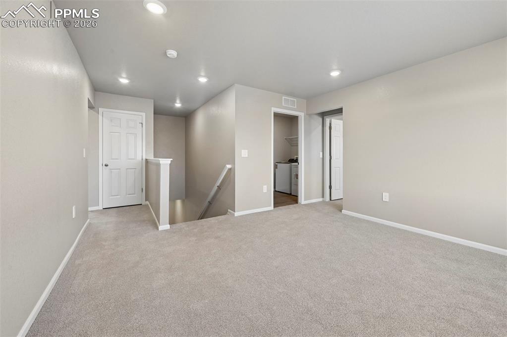 Unstaged oversized loft at top of the stairs, serves as family room, game room, sitting area!